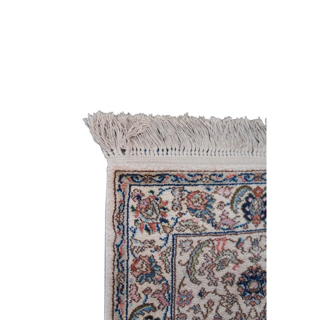 Vintage Karastan 100% wool area rug / mat / carpet featuring a floral motif inspired by palmettes and scrolled vines with...