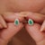 Elegant vintage-style stud earrings featuring natural pear-shaped emeralds set in 925 sterling silver. Each emerald is...