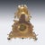 Antique 19th Century French Empire style ormolu bronze mantle clock. The foliate surround gilt dial, Inside with eight day...
