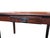 A handsome vintage writing desk handcrafted in Paraguay, featuring a warm cognac leather inset top with an elaborate hand-...