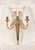 Louis XVI style, hand chased gilded bronze and malachite three-light sconces.