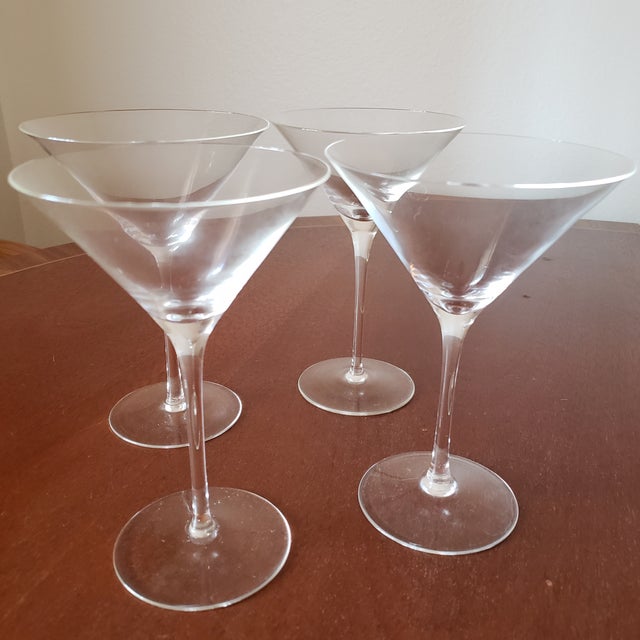 Set of four Martini glasses. Fine crystal, stemmed, very thin edge. Glasses are clear crystal even though the main image...