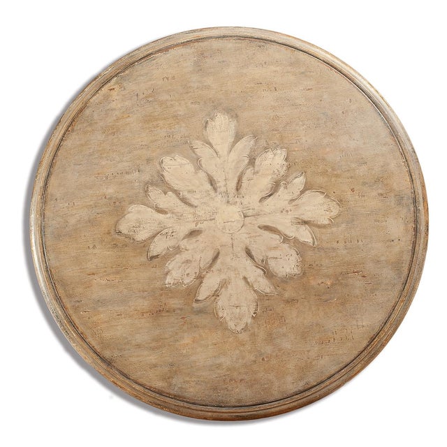 Handcrafted in Italy from solid beech wood, this round dining table features a beige antique rub-through finish that gives...