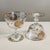 Sherbet Champagne Coupe Glasses Set of 4 Gold Encrusted Rose-Vine Pattern Circa 1960s Hand blown crystal glassware of...