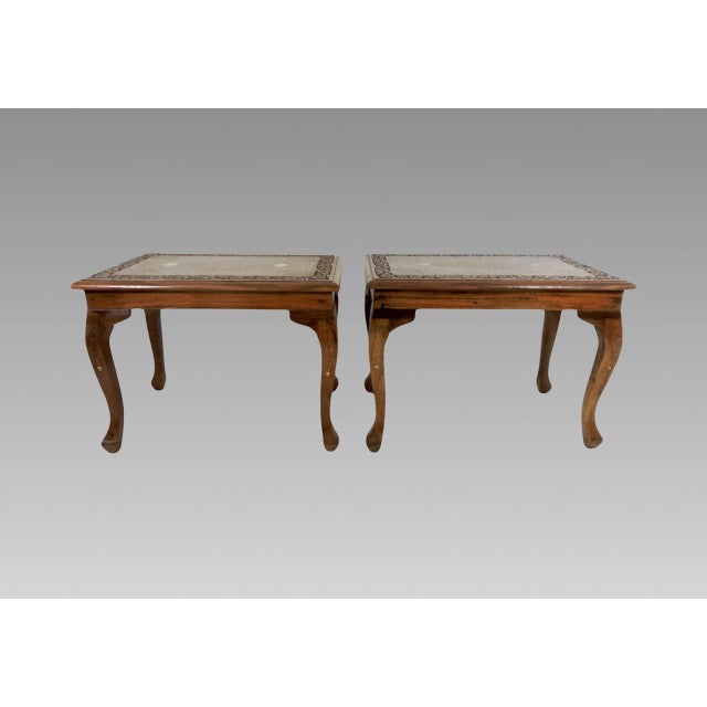 A pair of very useful matching solid teak rectangular style side tables. The tops are so exquisitly inlaid with fine brass...