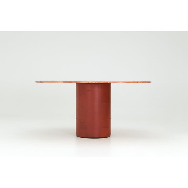 This dining table was designed by Afra & Tobia Scarpa for B&B Italia in the 1970s. The rectangular top has rounded edges...