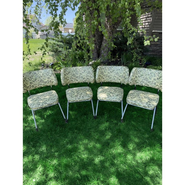 Stylish vintage set of four dining chairs by Brody Seating Company, featuring polished chrome frames and original...