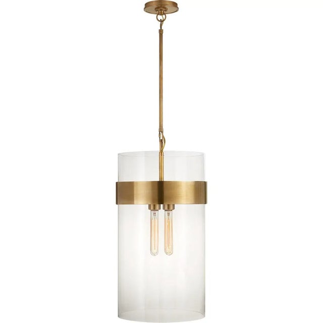 Presidio Medium Pendant in Hand-Rubbed Antique Brass with Clear Glass Designer: Ian K. Fowler Fixture Height: 24" Min....