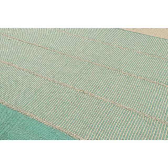 Handwoven in wool, a 10x13 Kilim design from an inventive new contemporary flat weave collection by Rug & Kilim. On the...