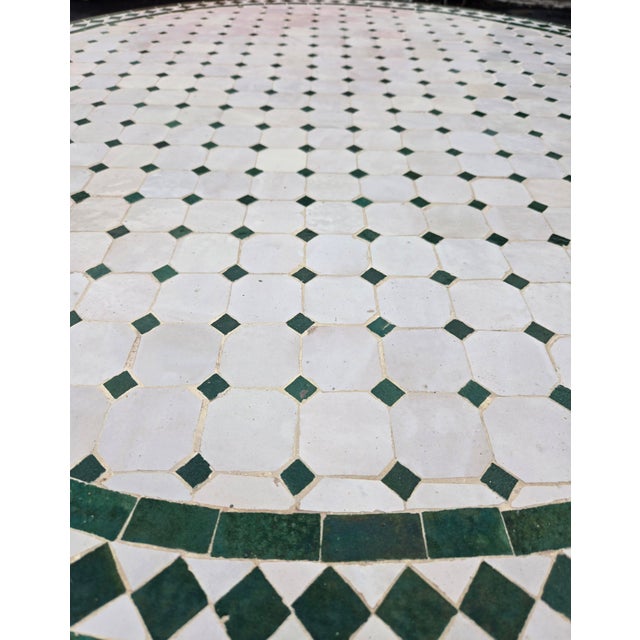 Beautiful handcrafted Moroccan mosaic table featuring an elegant white and green color palette. Measuring 48 inches in...