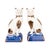 Seated side by side on gilt-trimmed cobalt cushions, this pair of English Staffordshire pottery cats brings genuine...