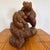 18” across 17” tall 11” deep Skillfully carved from a large log. The wood is a beautiful red hued wood. This was carved I....