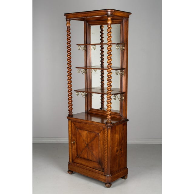 A 19th century French display cabinet from a chocolate shop. Made of solid mahogany with stunning, hand-turned spiraled...