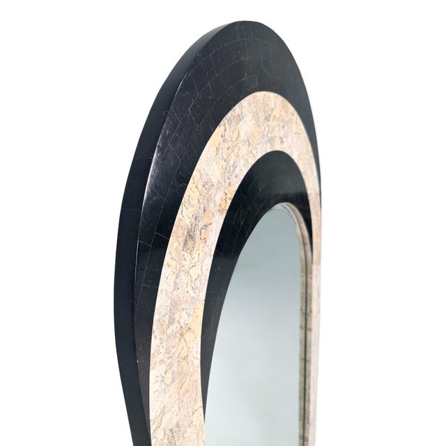 A striking vintage arched wall mirror by Maitland-Smith. Tessellated stone frame in contrasting two-tone pattern (black...