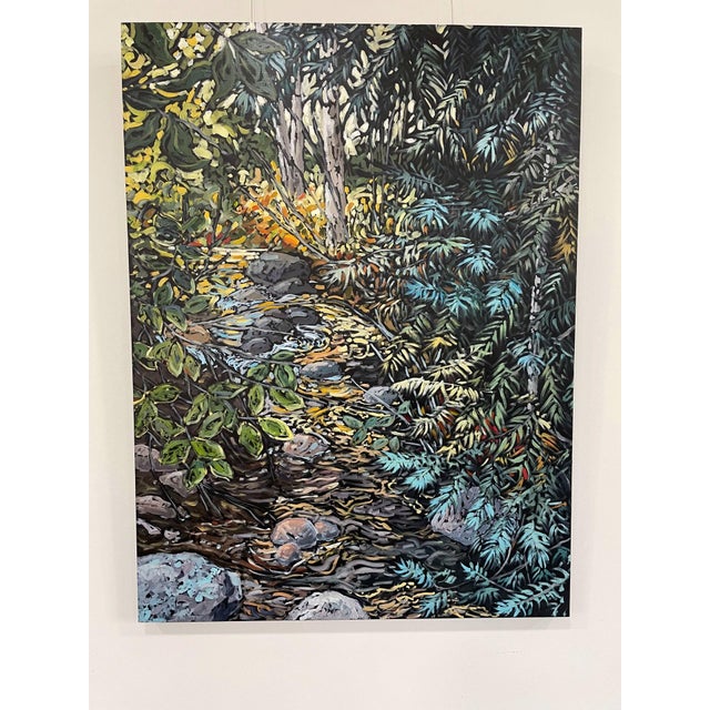 This oil painting captures a vibrant natural scene, where a stream meanders through lush foliage, illuminated by warm...