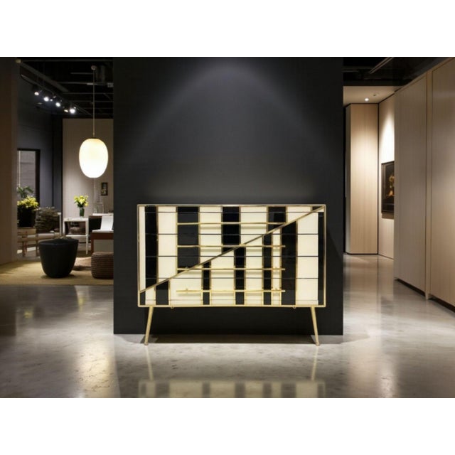 Presented with the restraint and composure of furniture designed for curated interiors, this chest of drawers by...
