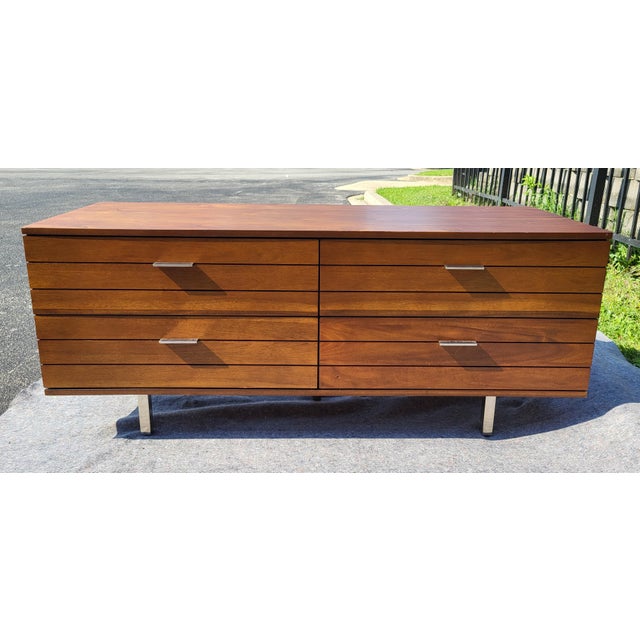 Linear Low 4-Drawer Wood Dresser from CB2. Acacia veneer with iron pulls and legs in brushed nickel finish. Smooth-gliding...