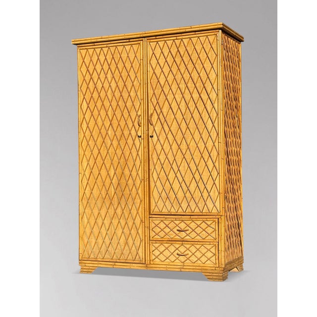 Charming 1970s French Riviera Bamboo & Wicker 2-Door Wardrobe This charming mid-20th-century French Riviera wardrobe in...