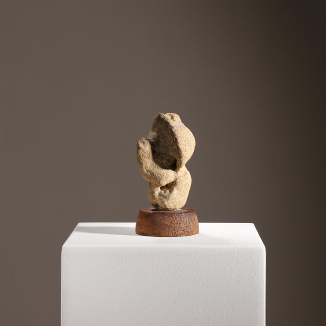 Authentic, organically shaped stone sculpture by German artist Hans-Hermann Lippold, 1971. This abstract work in beige...