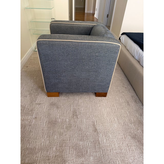 David Linley furniture, this is the CHASE chair in a blue fabric trimmed out in white with walnut feet.