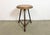 Vintage Industrial factory stool made in former Czechoslovakia during the 1960s It features a brown wooden seat and a grey...