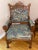 Antique solid oak hand-carved Eastlake era armchair, in modern floral re-upholstery. Fabric suffered cat-scratch damage as...