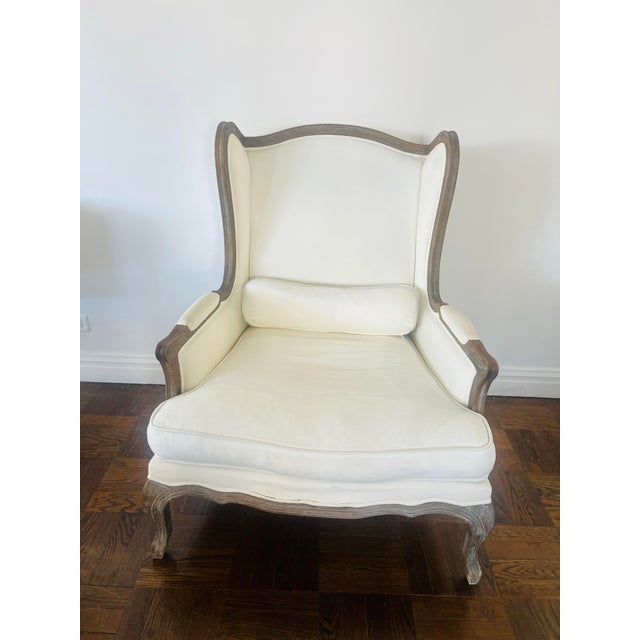 Deep wings serve to create a cozy enclosure that rebuffs drafts and captures the warmth of the hearth Frame: Handcrafted...