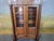 Small Empire-style bookcase, 19th century Elegant small bookcase/display cabinet in solid cherry wood, opening at the...
