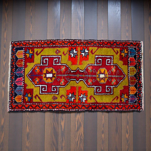 This vibrant hand-knotted small rug features a striking chartreuse field adorned with two bold geometric medallions,...