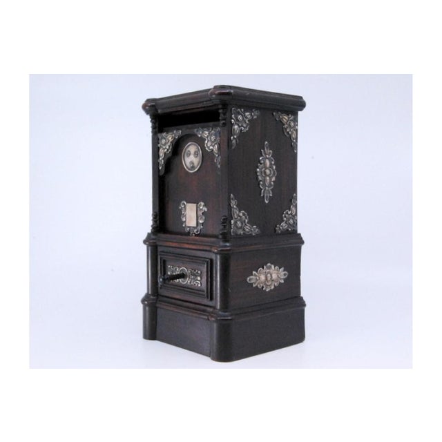 Piggy Bank in Rosewood with Silver Applications, in Very Good conditions. Designed 1920 to 1949 This piece has an...