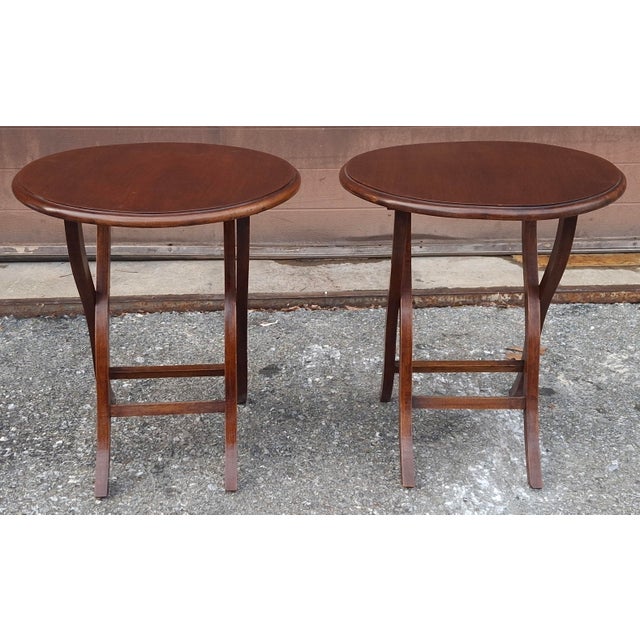 A Pair of vintage mahogany folding-form butler wine serving or coaching tables, designed as portable occasional furniture....