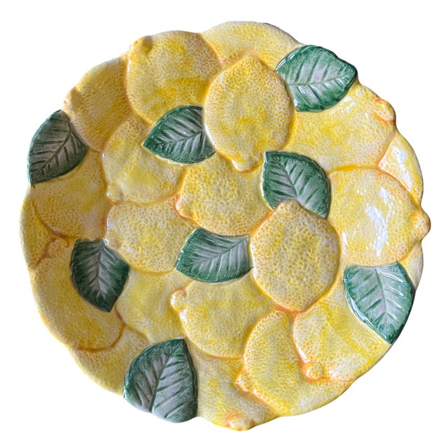A vibrant vintage lemon-motif serving platter by Fitz & Floyd, beautifully modeled in classic Italian majolica style. The...