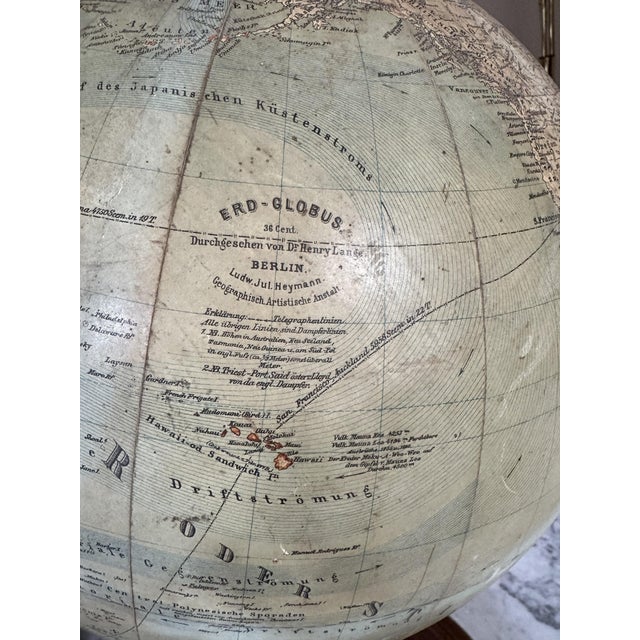This exquisite antique globe, crafted before the outbreak of World War I, is a rare and captivating piece that epitomizes...