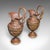 This is a pair of antique display urns. An Italian, bronze decorative ewer in Grand Tour taste, dating to the Victorian...
