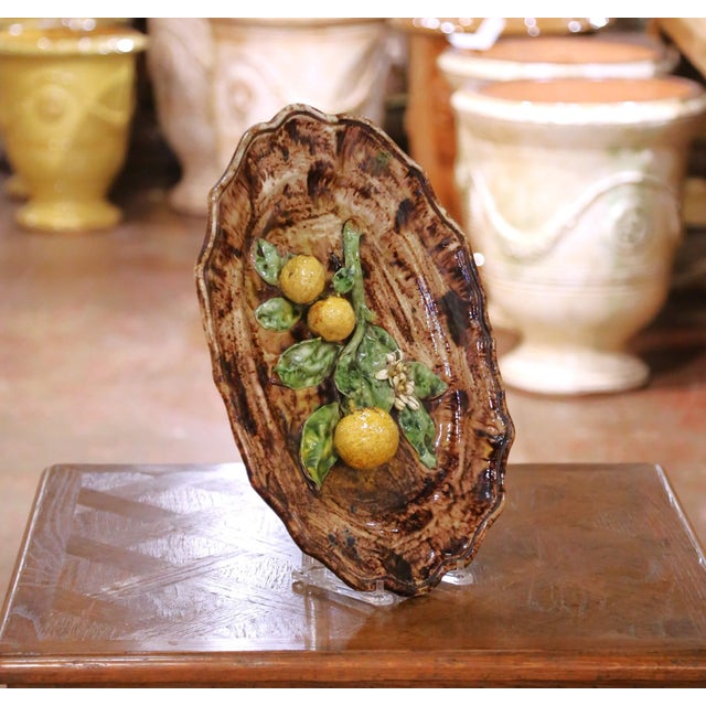 Crafted in France circa 1890, this antique barbotine ceramic platter was produced by the Tardieu Fils workshop in Menton,...