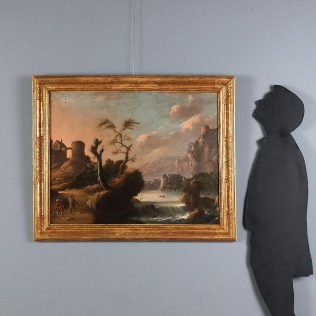 Oil on canvas. The broad landscape frames a glimpse of a lush, green plain at the foot of rocky outcrops; a navigable...