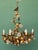This stunning six light Italian gilded toleware chandelier features a foliage design with leaves and glass roses...