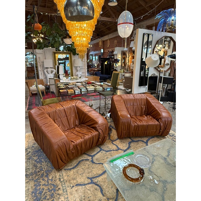 Pair of vintage “Piumino” armchairs by De Pas, D’Urbino & Lomazzi for Dell’Oca, Italy, 1970s. Upholstered in rich cognac...