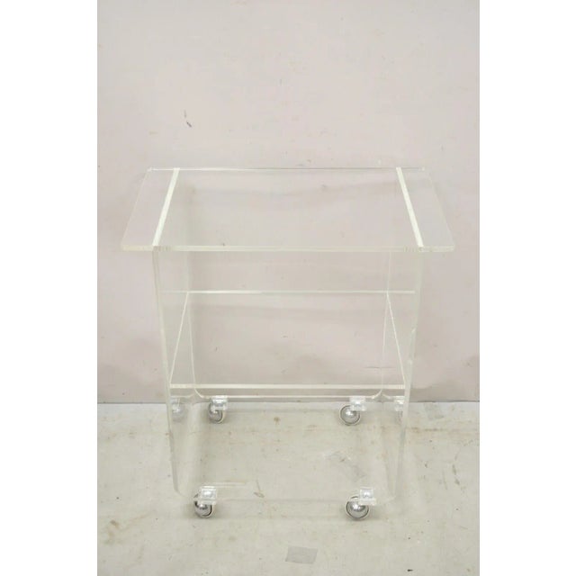 Vintage Clear Lucite Acrylic Mid Century Modern Rolling Bar Cart Side Table. Middle and lower shelf, rolling casters,...