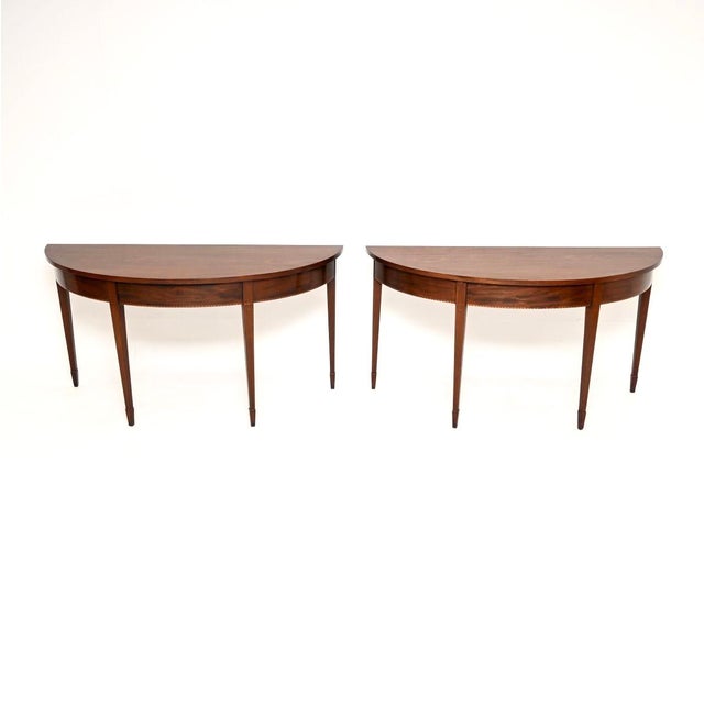 A beautiful and very impressive pair of antique console tables. They were made in England, they are in the Georgian...