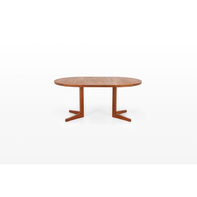 Elegant danish dining table from the 1960s, crafted in warm teak. The sharper edges and clean lines give this piece a more...