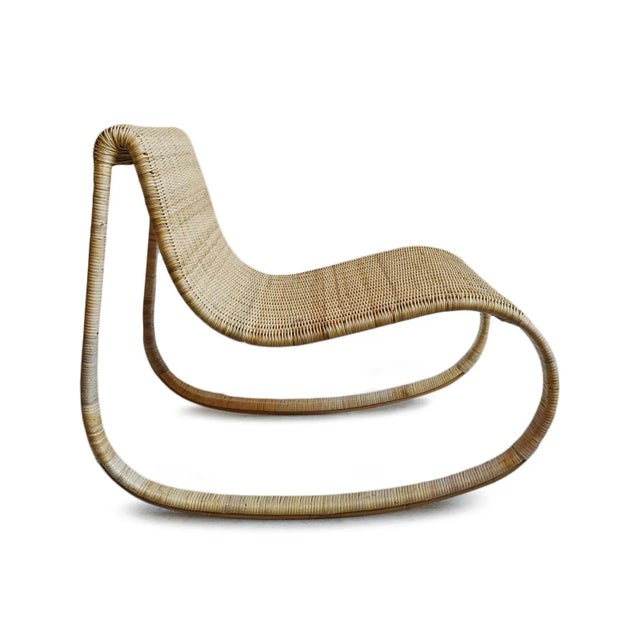 Beautiful hand formed and woven raw rattan rocking chair. Each will have slight variations in tones and inherent...
