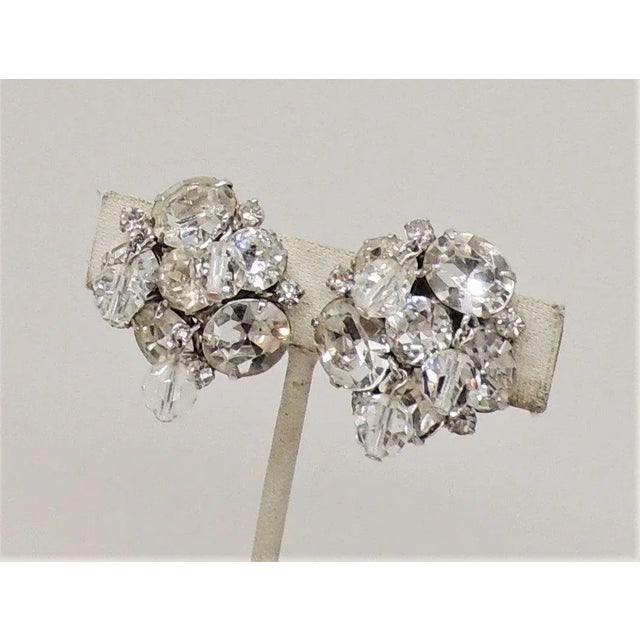 Metal Vintage 1960s Signed Kramer Rhodium Plated Clear Rhinestone Dangle Clip Earrings - 2 Pieces For Sale - Image 7 of 9