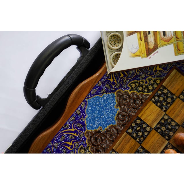 A one-of-one luxury chess and backgammon set, hand-painted with indigo and turquoise Tazhib-inspired ornament. This...