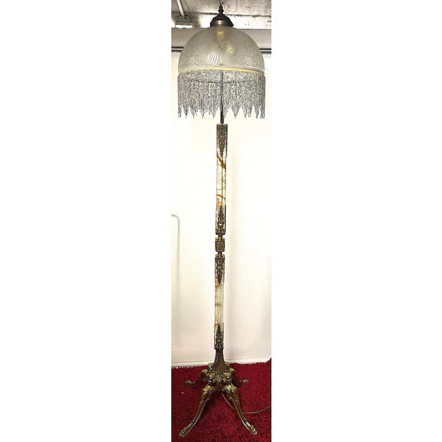 Single Brass and Onyx Bead Glass Shade Cherub Floor Lamp, 1950s, in Very Good conditions. Designed 1950 to 1959 I have...