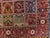 Rich in tone rug displaying garden panel within floral decorated red border. Lush wool pile on cotton foundation. A rare find