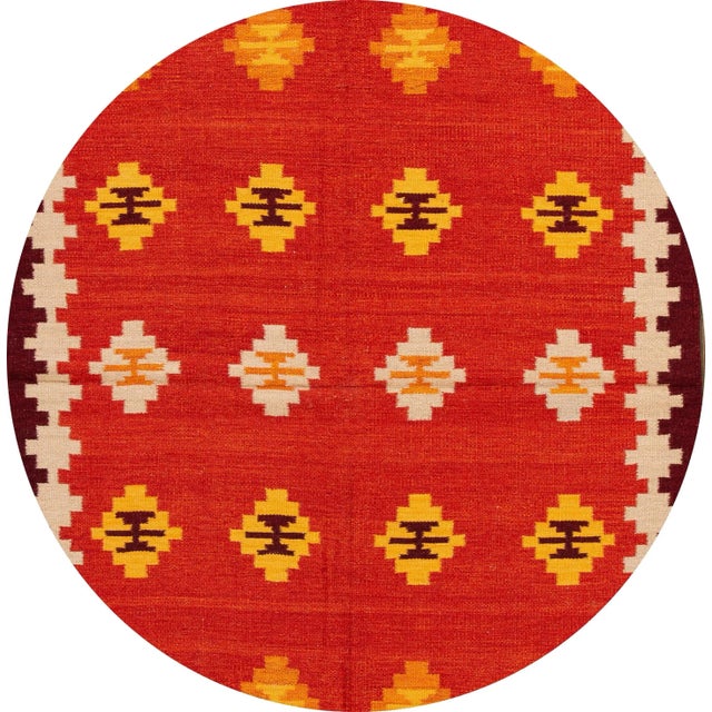 A beautiful hand-woven modern Kilim rug with an orange field and multi-color accents in an all-over geometric design. This...