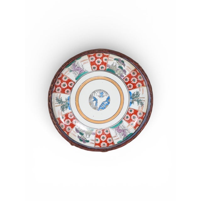Attractive Japanese plate, with wicker basketweave backing. The ceramic plate is in excellent, original, clean condition,...