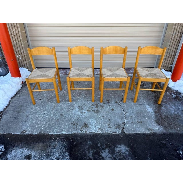 Set of Four Vintage Blonde Beechwood Rush Seat Dining Chairs. Solid wood frame sturdy, some stain on rush seat Good...