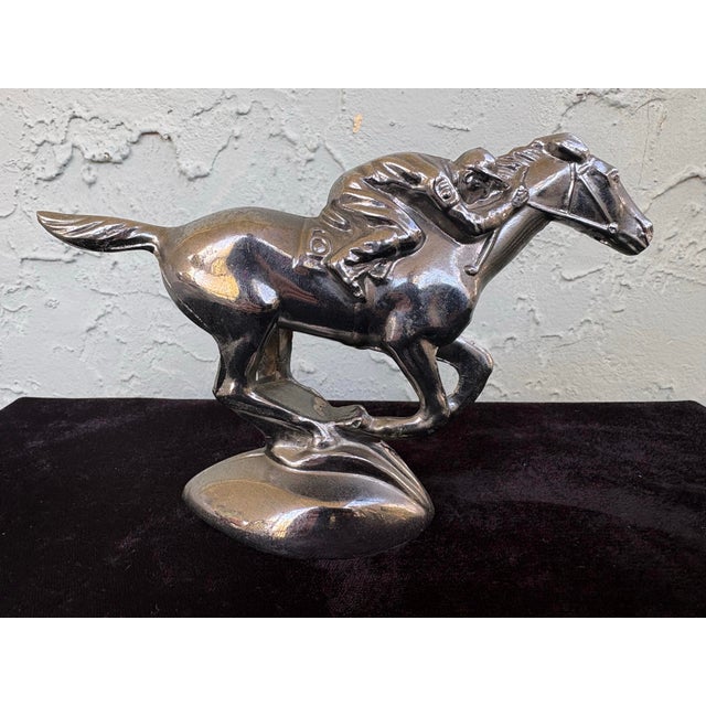 Bring classic automotive history into your décor with this vintage cast-metal hood ornament featuring a jockey and...